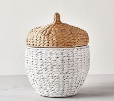 a white and brown basket with a lid