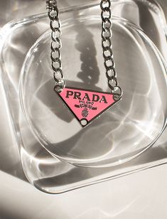 Pink Prada necklace 1 Luxury Edgy Jewelry For Gifts, Luxury Edgy Jewelry Gift, Luxury Designer Necklace For Gift, Prafa Necklace, Prada Triangle Logo Necklace, Luxury Jewelry For Streetwear, Luxury Gift Necklace, Slay Necklace, Prada Necklace