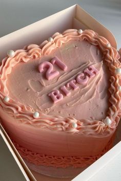 a heart shaped birthday cake in a box