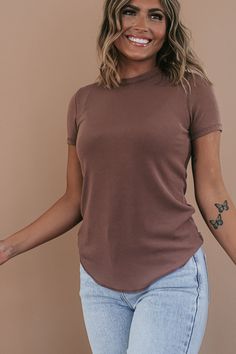 Our Basic Ribbed Tees are crafted from a stretchy ribbed fabric that is oh-so-comfortable. This piece features a full-length fit and a rounded hemline. An ideal basic meant for year-round wear. Neckline: Round Fabric: 65% Rayon, 30% Polyester, 5% Spandex Comfortable stretch Sizing (based on standard sizing): S (4/6) M (8/10) L (10/12) Designed with generous stretch fabrication and crafted to have a slimming true to size fit Model Specs: Emily is wearing a size small in the photo.How will this it Everyday Ribbed Crew Neck Top, Ribbed Crew Neck Top, Casual Stretch Tops In Specific Color, Stretch Casual Tops, Stretch Solid Color Tops For Layering, Basic Stretch Plain Tops, Casual Ribbed T-shirt For Loungewear, Solid Color Crew Neck Top For Layering, Crew Neck Solid Color Tops For Layering