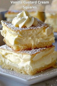 vanilla custard cream squares are stacked on top of each other