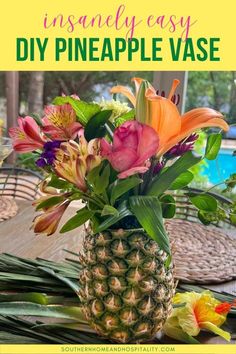 a pineapple vase filled with colorful flowers on top of a table next to a pool