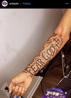 a person with a tattoo on their arm that says, fearoont above the words