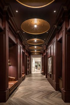 the hallway is lined with wooden paneled walls