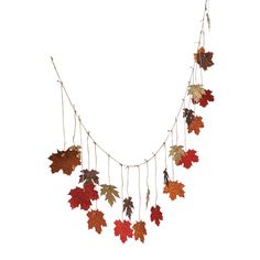 a long necklace with autumn leaves hanging from it