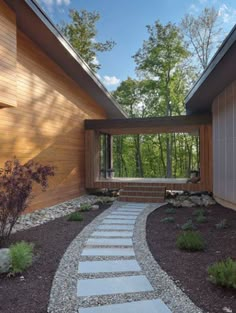 a house with a stone pathway leading to the front door