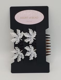 This is a set of 2 combs with hand beaded leaves, in tones of white with a touch of silver.  Tuck these into a bun, or to simply hold back a lock of hair.   Also available to custom order in your bridal colors for the bridesmaids to wear, and also have a nice gift from the bride.  Special thanks to YourMiyukiPatterns for the pattern. Beaded Leaf, Hair Locks, White Leaf, Hair Comb, Comb, Barrettes, Hand Beading, Best Gifts, Hair Accessories