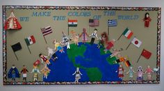 a bulletin board with people holding flags and the words make colors the world on it