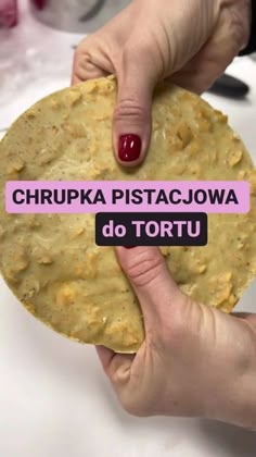 a person holding up a tortilla with the words chippa pistac - jowa do tortu on it