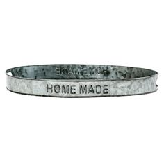 a metal belt with the words home made written in black and white ink on it