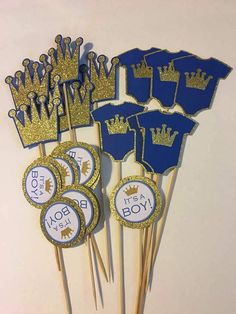 blue and gold cupcake toppers with royal crowns on them