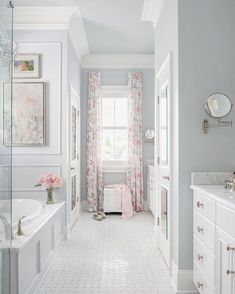 the bathroom is decorated in white and pink