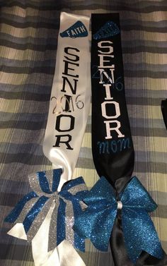 three ribbons with the words senior and mom on them are laying on a plaid blanket