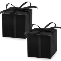 two black gift boxes with ribbons on them