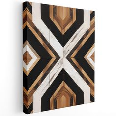 an abstract painting with black, brown and white colors on the wall in a geometric pattern