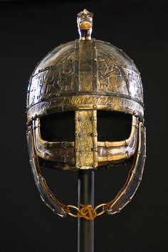 an antique helmet is on display in a museum