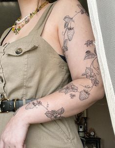 a woman with a tattoo on her arm