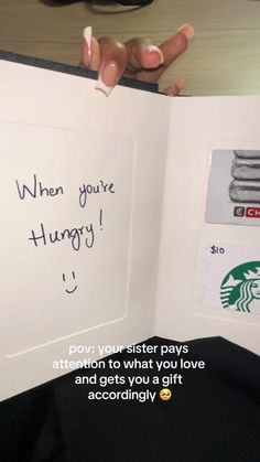 someone is holding an open starbucks card with the message when you're hungry, attention to what you love and gets you a gift according