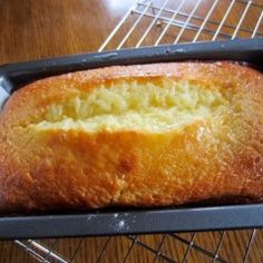 a loaf of bread sitting on top of a metal rack