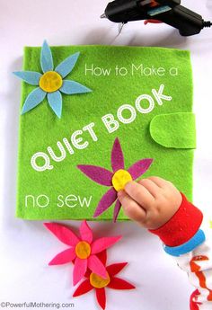 a child's hand holding a felt book with flowers on it and the title how to make a quiet book no sew