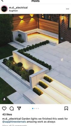 an aerial view of a modern garden with lights on the steps and plants growing in the planters