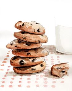 a stack of cookies next to a glass of milk