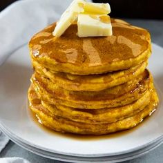 a stack of pancakes with butter on top