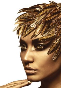 a woman with gold feathers on her head