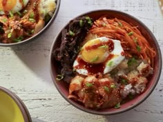 two bowls filled with different types of food