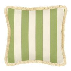 a green and white striped pillow with fringe trim