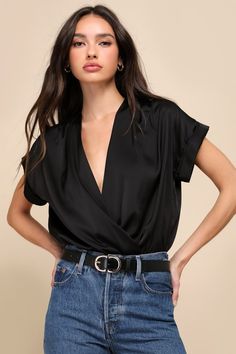 Take your outfit to extra luxe levels with the help of the Lulus Posh Precision Black Satin Surplice Short Sleeve Bodysuit! Super sleek woven satin shapes this elegant bodysuit with a flattering surplice neckline, short sleeves with sewn rolled cuffs, and a relaxed bodice with gathered details at the waist. Attached, knit thong bottoms have snap closures. Fit: This garment fits true to size. Length: Size medium measures 30.50" from shoulder to hem. Bust: Great for any cup size. Waist: Not Fitted Elegant Bodysuit, Satin Bodysuit, Body Suit With Shorts, Lulu Fashion, Short Sleeve Bodysuit, Black Bodysuit, Black Satin, Short Sleeves Tops, Apparel Accessories