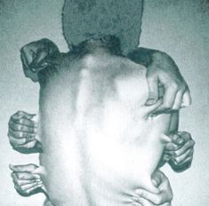 a black and white photo of someone holding their head in the shape of a man