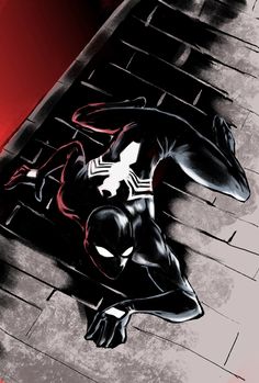 a drawing of a spider - man laying on the ground in front of a brick wall