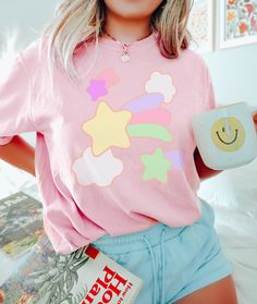 ⚝ Dreamy Pastel Shirt~ Awesome, stylish, simple. This goes well with jeans, shorts, or tuck into pants to complete your cool & urban, and comfy look! ⚝  ✨Don't see your favorite color? Shoot us over a message and we'll look into all the options!✨ 💟Product Details: ❥Handmade design ❥Breathable Comfort. ❥ True to size (UNISEX fit) ❥ Fabric: 100% Cotton (crewneck, lightweight and breathable, soft and comfortable ) ❥Care Instruction: Machine wash cold with similar colors, do not bleach, tumble dry Trendy Cotton Tops With Cute Design, Pastel Business Casual, Trendy Tops With Star Patch For Spring, Cute Pastel Crew Neck Tops, Trendy Spring Tops With Star Patch, Trendy Star Patch Tops For Spring, Cute Pastel Tops, Trendy Pastel Crew Neck Top, Cute Pastel Cotton Top