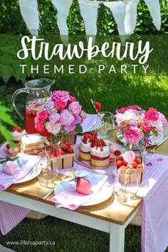 strawberry themed party with pink flowers and desserts on a table in the grass outside