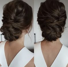 the back of a woman's head, showing her hair in a low bun