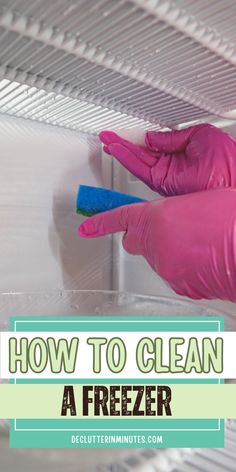 a person in pink gloves cleaning a freezer with a sponge on it and the words, how to clean a freezer