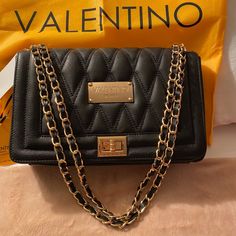 Valentino Milano Alice Va 6118, Black Bag With Tag, Brand New. - Authentic - Genuine Leather - Convertible Leather Woven Chain Shoulder Strap - Fold Ever Flap With Turn Lock Closure - Center Zip Compartment - Three Inside Open Pocket - One Inside Zip Pocket - Fabric Lining - Black Leather - Includes Dust Cover - Made In Italy Valentino Bag Handbags, Valentino Rockstud Bag, Valentino Crossbody Bag, Valentino Purse, Valentino Bag, Valentino Handbags, Dress Leopard, Valentino Black, Mario Valentino