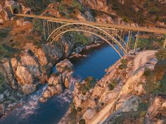 an artist's rendering of a bridge over a river in the middle of mountains