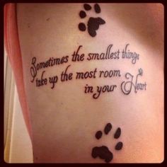 a woman's back with a tattoo saying sometimes the smallest things take up the most room in your heart