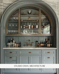 Luxurious arched bar with sage green cabinetry, marble counters, and brass hardware for timeless appeal.  #InteriorDesign #OwnArchitecture #Decor #Inspiration #InteriorInspo #DreamHouse #DreamHome Green Marble Bar Counter, Bar With Arches Design, Arched Butlers Pantry, Home Bar Art Deco, Built In Bar With Arch, Arch Wet Bar, Arched Dry Bar, Arched Built In Bar, Arched Wet Bar