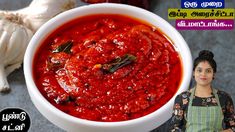 a woman standing in front of a bowl of red sauce with garlic on the side