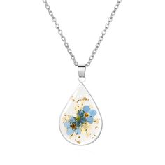 a necklace with blue and yellow flowers in the shape of a tear on a chain