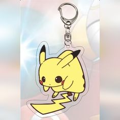 a pokemon pikachu keychain with a lightning bolt on it's side