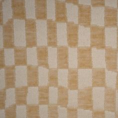 an orange and white checkerboard pattern on fabric