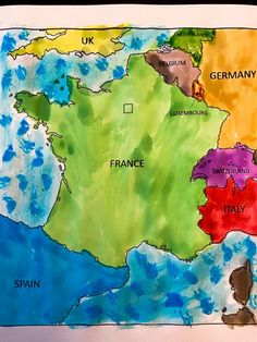 a child's drawing of europe with watercolors on paper and colored background