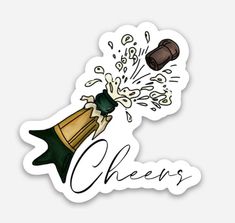 a sticker with the word cheers coming out of it and a champagne bottle in the background