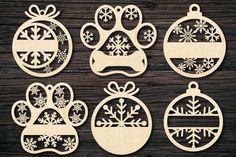 laser cut christmas ornaments with snowflakes and dog's paw