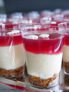 small desserts with red and white toppings on a tray