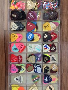 several different types of guitar picks in a clear case